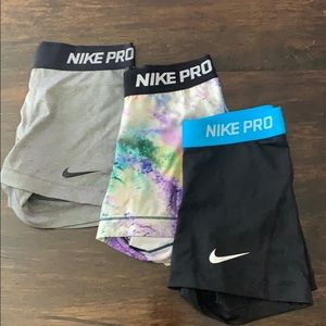 Three pairs of Nike Pro shorts